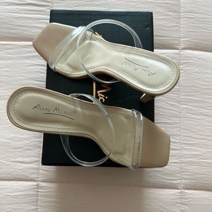 Comfortable two strap heel. Heel is not too high and straps not too tight.